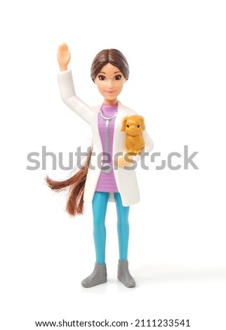 Doctor toy figurine isolated on white background