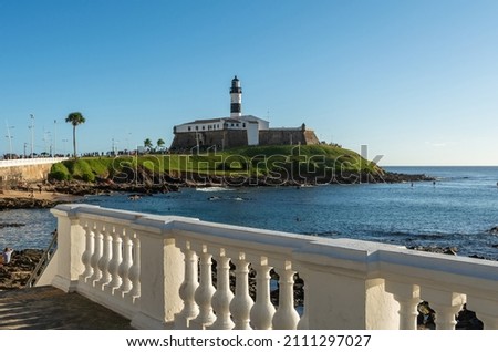 View of the Farol da Barra Lighthouse at Salvador, Bahia. Todos os Santos Bay on a sunny summer day. Historic architecture of Salvador, Brazil