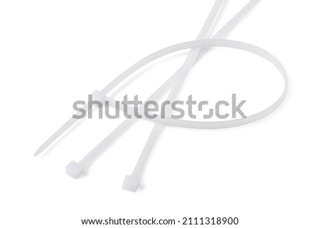 White plastic cable ties isolated on a white background Royalty-Free Stock Photo #2111318900