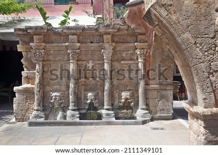 Rimondi Fountain, built in 1626, in the Old Town of Rethymnon, Crete island, Greece, Europe. Named after the Venetian governor of the period, A. Rimondi, it continually threw water from three springs  Royalty-Free Stock Photo #2111349101