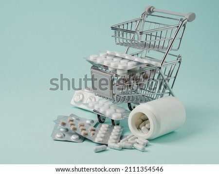 The concept of buying and buying medicines. Various capsules, pills and medicines in a shopping cart on a white background. A creative idea for a medical, insurance and pharmaceutical company. Space f