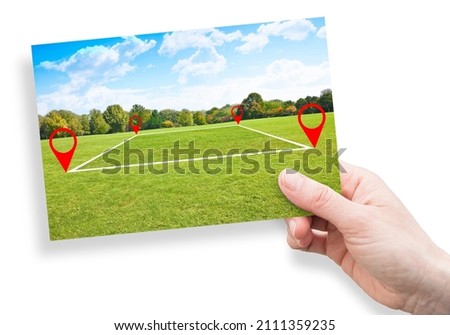 Land plot management - real estate concept with a vacant land on a green field available for building construction and housing subdivision in a residential area for sale, rent, buy or investment. Royalty-Free Stock Photo #2111359235