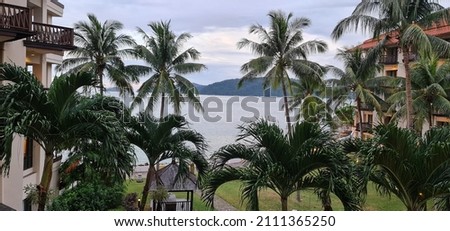 seaview from hotel room at Kota Kinabalu. nice view of sea and coconut trees Royalty-Free Stock Photo #2111365250