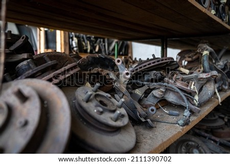 parts of dismantled cars at the car wreck Royalty-Free Stock Photo #2111390702