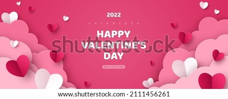 Horizontal banner with pink sky and paper cut clouds. Place for text. Happy Valentine's day sale header or voucher template with hearts. Rose cloudscape border frame pastel colors. Royalty-Free Stock Photo #2111456261