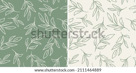 Set of leaves seamless repeat pattern. Random placed, vector botany elements hand drawn all over surface print on sage green and beige background. Royalty-Free Stock Photo #2111464889