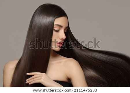 Fashion woman with straight long shiny hair. Beauty and hair care Royalty-Free Stock Photo #2111475230