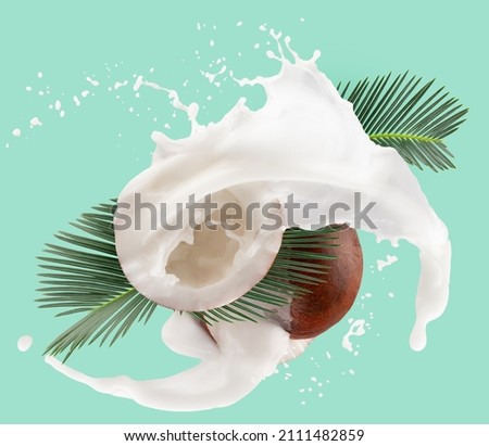 coconuts with green leaves and milk splash on light green background