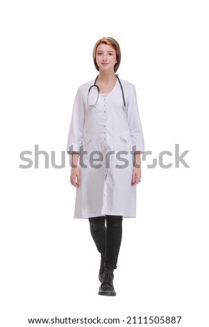 Female health care worker from the back - looking at something