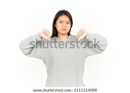 Showing Thumbs Down Of Beautiful Asian Woman Isolated On White Background
