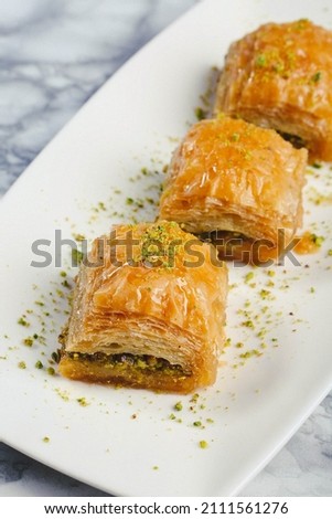 Traditional turkish dessert baklava with cashew, walnuts. Homemade baklava with nuts and honey. Royalty-Free Stock Photo #2111561276