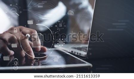 Document Management System (DMS) being setup by IT consultant working on laptop computer in office. Software for archiving, searching and managing corporate files and information Royalty-Free Stock Photo #2111613359