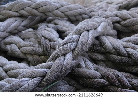 theold braid rope(tali tambang) used for tie the big traditional fishing boat  Royalty-Free Stock Photo #2111626649