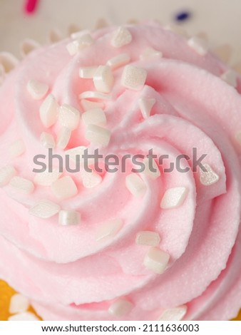 macro photography. Pink cream on cake. Sweet calorie food. Holidays, surprises, beautiful decoration of cakes and pastries. Cooking, confectionery, home cooking, advertising.