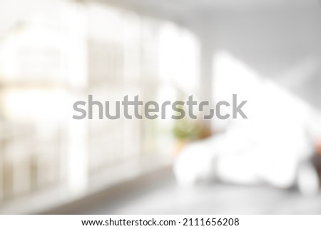 Blurred view of light bedroom with big window Royalty-Free Stock Photo #2111656208