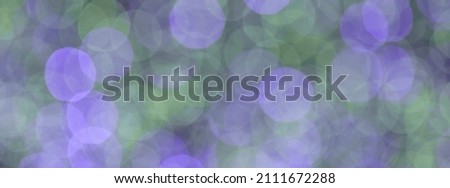 Defocused photography of festive bright lights in night. Blue and green  
shades of colors. Bubbles backgrounds. Panoramic image