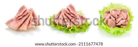 Tuna fish isolated. Canned tuna on green salad leaf. Tuna can on white background. Collection. Royalty-Free Stock Photo #2111677478