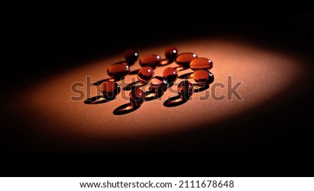 toco-sorb supplement softgels in lowkey. immune prevention supplement red pills
 Royalty-Free Stock Photo #2111678648