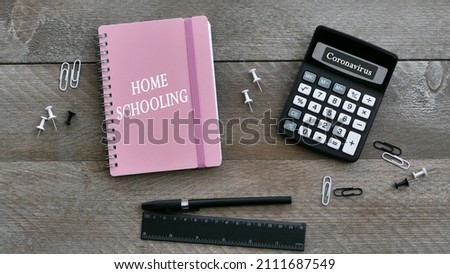 Homeschooling notepad with writing utensils.
