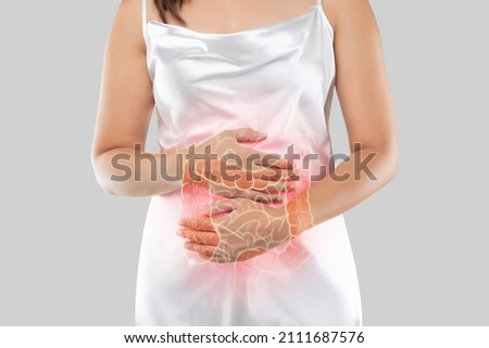 The photo of large intestine is on the woman's body, isolate on white background, Female anatomy concept	