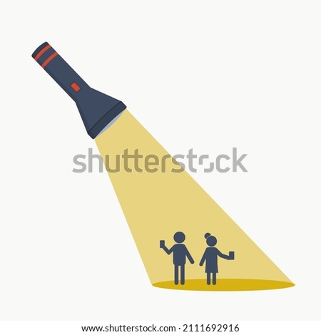 A man and a woman with phone in the light of a pocket flashlight. Template for text. Place of advertisement.