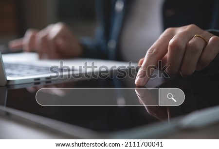 Data Search Technology Search Engine Optimization SEO concept. Business woman hand using digital tablet and laptop computer searching information, search console for website.