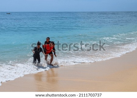 Play with family. Father carrying his son on the beach. vacation with family. Father and son game