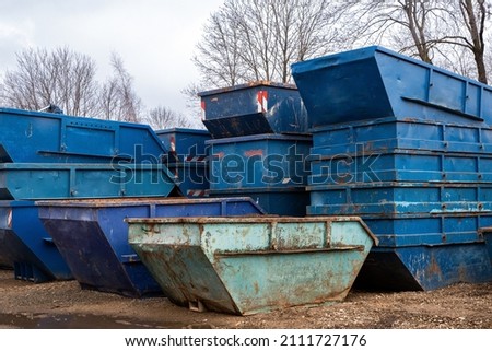 Blue metal scrap container on the street
 Royalty-Free Stock Photo #2111727176