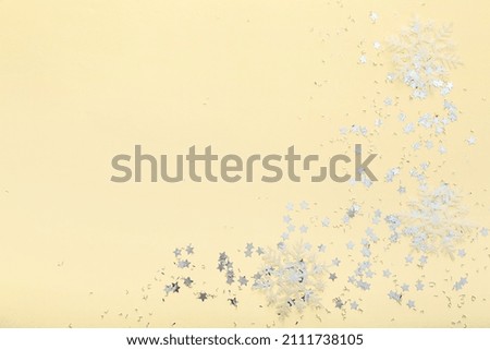Beautiful confetti on beige background