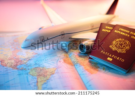 trip in America - passport, airplane and map of world  Royalty-Free Stock Photo #211175245