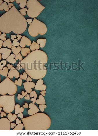 valentine's day greeting card-wooden hearts on a gray suede background. High quality photo