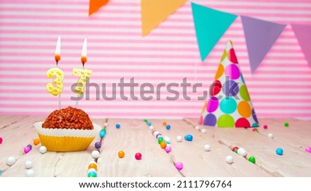 Happy birthday for 37 years old. Festive background with muffin. Copy card birthday for thirty seven years on a pink background
