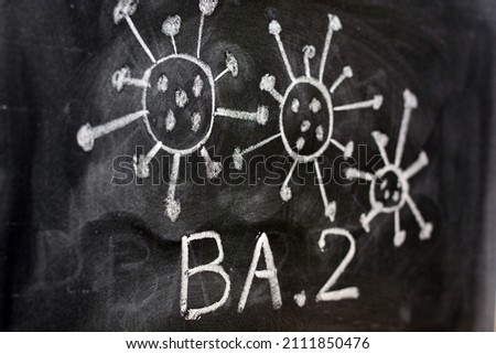 Variant of covid 19 virus, omicron BA. 2, drawn on a blackboard with chalk Royalty-Free Stock Photo #2111850476
