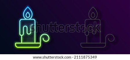 Glowing neon line Burning candle in candlestick icon isolated on black background. Cylindrical candle stick with burning flame.  Vector