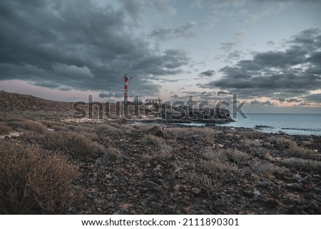 View of the lighthouse on the south coast of Tenerife with a monumental sky after sunset