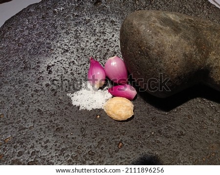 picture of cobek and muntu spice grinder brambang, miri and salt made of stone