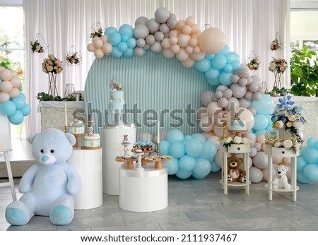 Happy Birthday! Children's decoration with glowing lights, birthday garland, different color of balloons. Decorated photo zone. Festive decorative elements, photo area Royalty-Free Stock Photo #2111937467