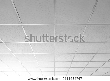 Background and Texture of Aluminum T-bar Ceiling with white Gypsum Board in low angle and perspective view Royalty-Free Stock Photo #2111954747