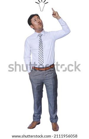 Excited young asian businessman having an idea and pointing finger up isolated on white background