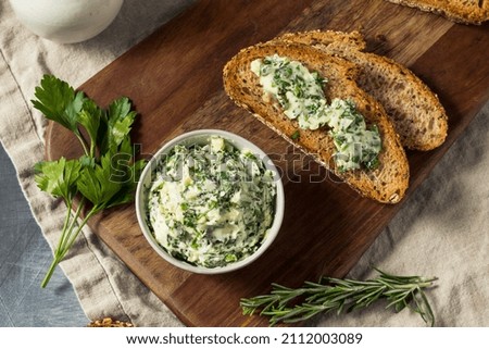 Healthy Homemade Herb Butter and Bread with Rosemary and Parsley Royalty-Free Stock Photo #2112003089