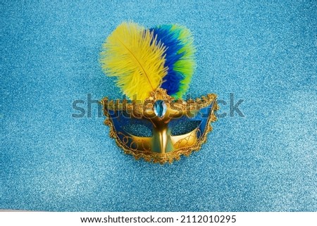 Carnival mask in Brazilian colors for carnaval holiday background concept.