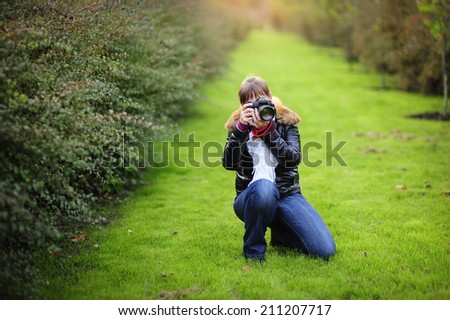 Photographer taking pictures outdoors