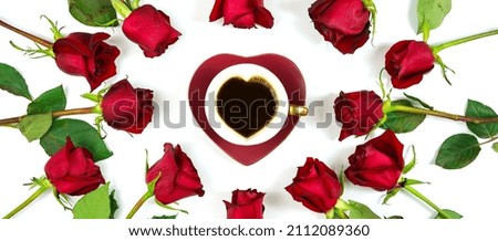 Happy Valentine's Day red roses creative composition flat lay layout with coffee in heart shaped cup and saucer on white background. Sized to fit popular social media and web banner.