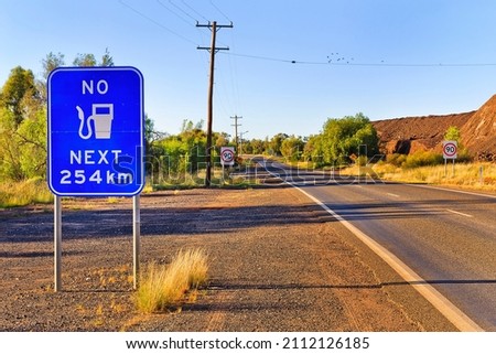 Large warning road sign no fuel next 250 kilometers on a highway off Cobar town in outback australia.