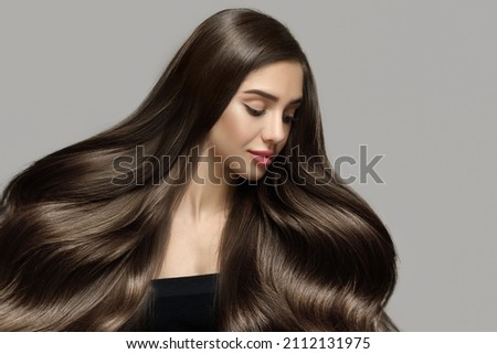 Long beautiful wavy hair. Portrait of a woman with shiny blond hair. copycpase Royalty-Free Stock Photo #2112131975