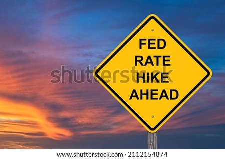 Fed Rate Hike Ahead Caution Sign - Sunset Background Royalty-Free Stock Photo #2112154874