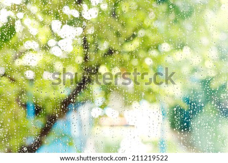wet home window with raindrops after summer rain