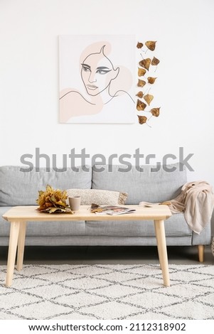 Interior of modern living room with autumn decor