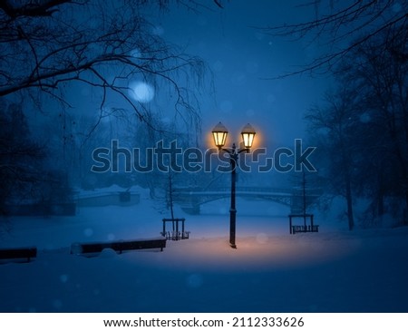 A night scenery of snowy Riga - capital of Latvia. Winter picture of Northern Europe.