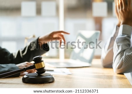 Business lawyer is currently counseling the client's trial at the lawyer office, lawyer concept. Royalty-Free Stock Photo #2112336371